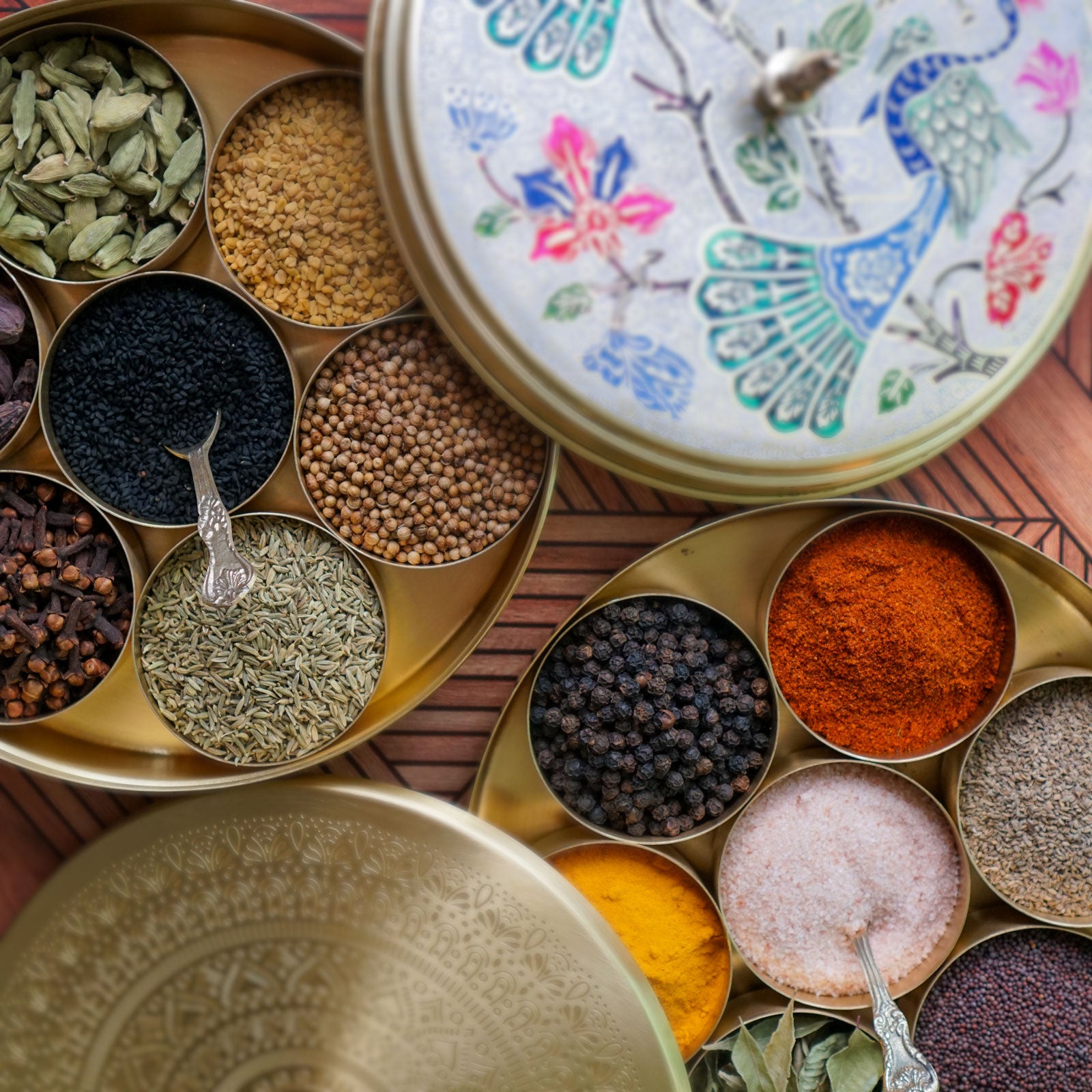 Two Indian Spice Boxes (aka Masala Dabba) filled with organic spices from our Indian Spice Kit. Purchase together as an Indian Spice Box Gift Set.