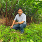 Sandeep holding freshly harvested cardamom on a recent trip to India
