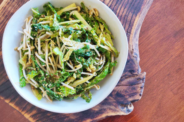 Simple and delicious bowl of a Tamarind Asian Salad, displayed on a lovely wooden board. Made with our tamarind puree.