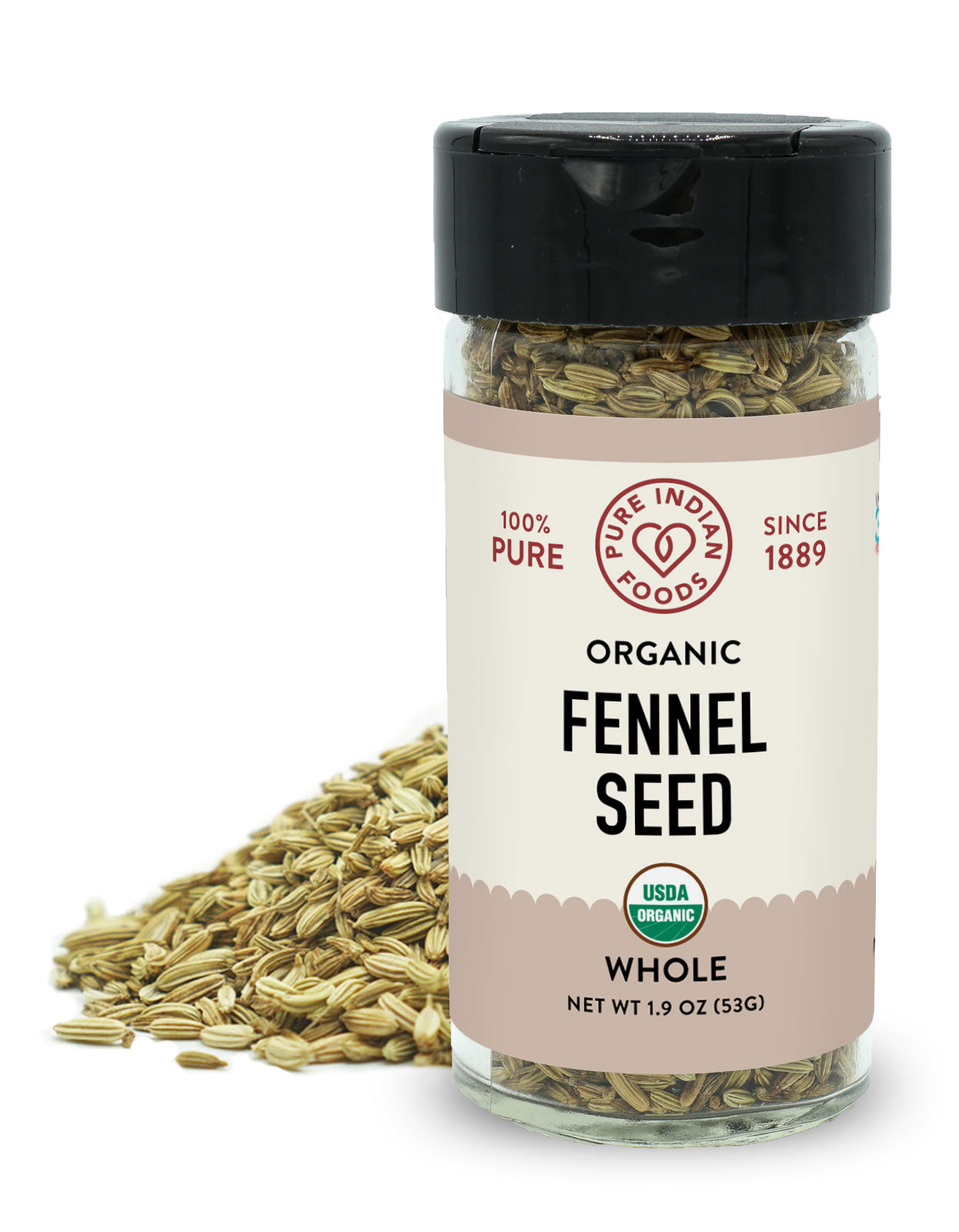 A jar of organic fennel seed from Pure Indian Foods is placed in front of a small pile of whole fennel seeds on a white background.