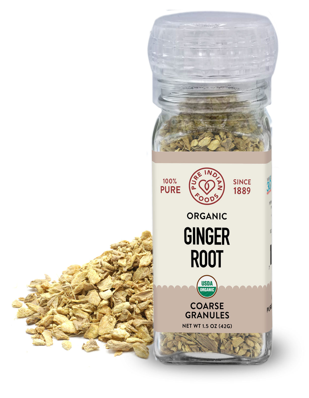 Minced organic dried ginger in a grinder top bottle from Pure Indian Foods.