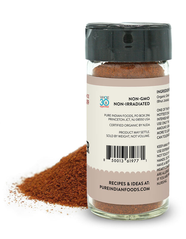 Side label on a jar of Smoked Ghost Pepper Powder from Pure Indian Foods stating the product is non-gmo and non-irradiated and Whole 30 Approved