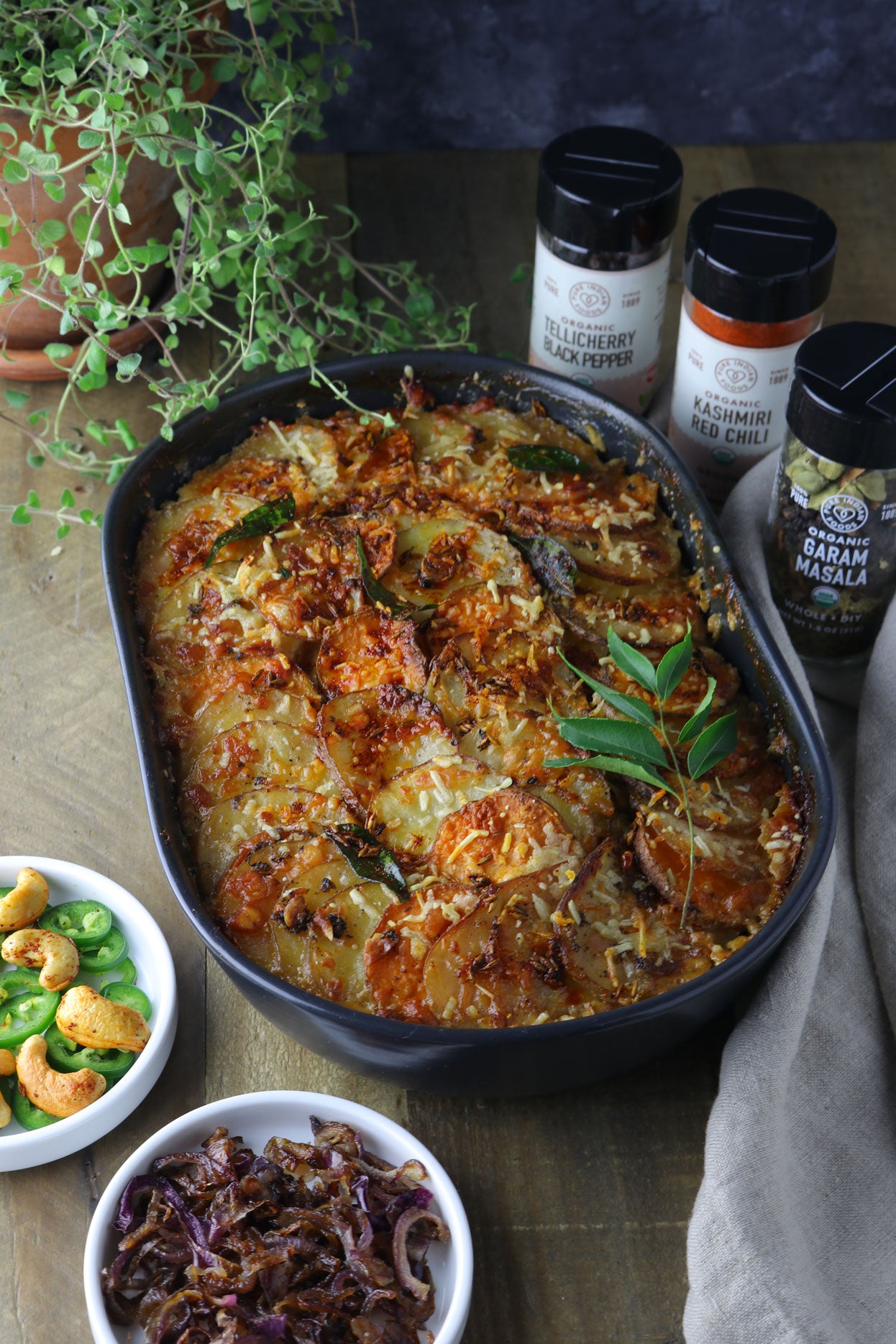 Spicy Indian Potato Gratin made with our Pure Indian Foods Organic Garam Masala, Organic Kashmiri Chili Powder, and Organic Tellicherry Black Peppercorns. So delicious!