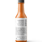 Ingredients label on a bottle of Pure Indian Foods KICK Hot Sauce, an organic Mango hot sauce made with red bell peppers, aphonso mango puree, vinegar, carrots, garlic, seal salt, and smoked Ghost pepper