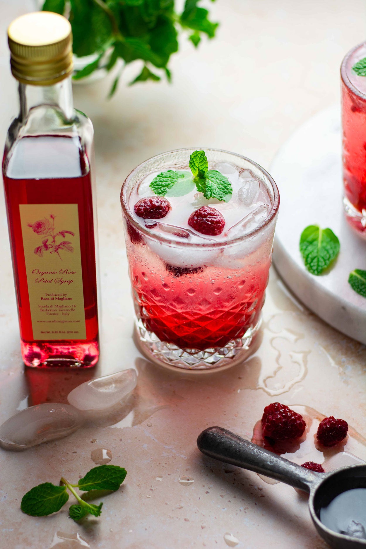 Raspberry mint cocktail made with our organic rose syrup.