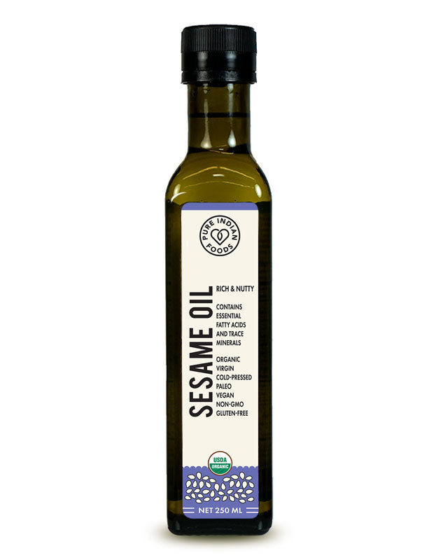 A bottle of organic sesame seed oil from Pure Indian Foods. Cold pressed. Rich & nutty. Contains essential fatty acids and trace minerals.