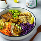 A vegetarian tempeh rice bowl drizzled with the tamarind chutney from Pure Indian Foods.