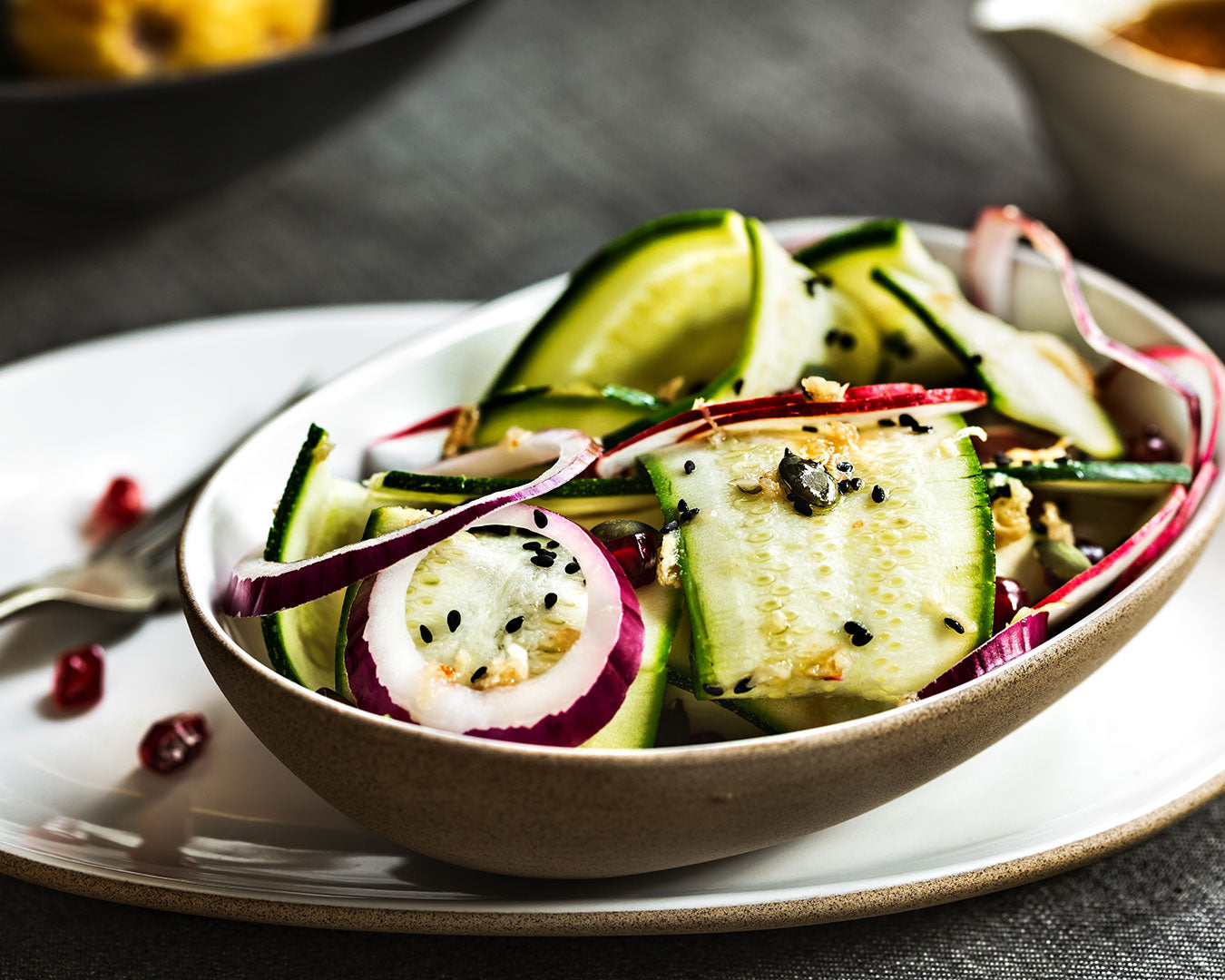 Zucchini and red onion with organic black sesame seeds, soy sauce, and ginger
