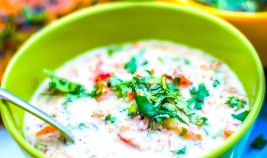 Cucumber Carrot Cilantro Raita in a green bowl