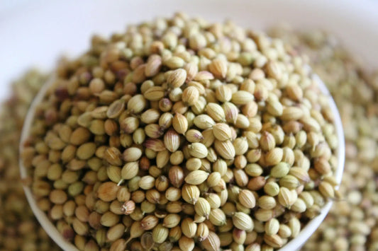 an overflowing bowl of coriander seeds