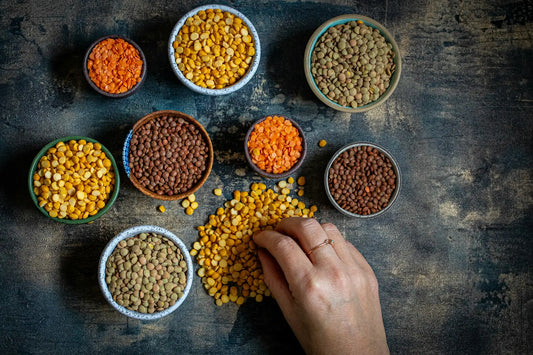 birds eye view of various bowls of lentils and legumes 