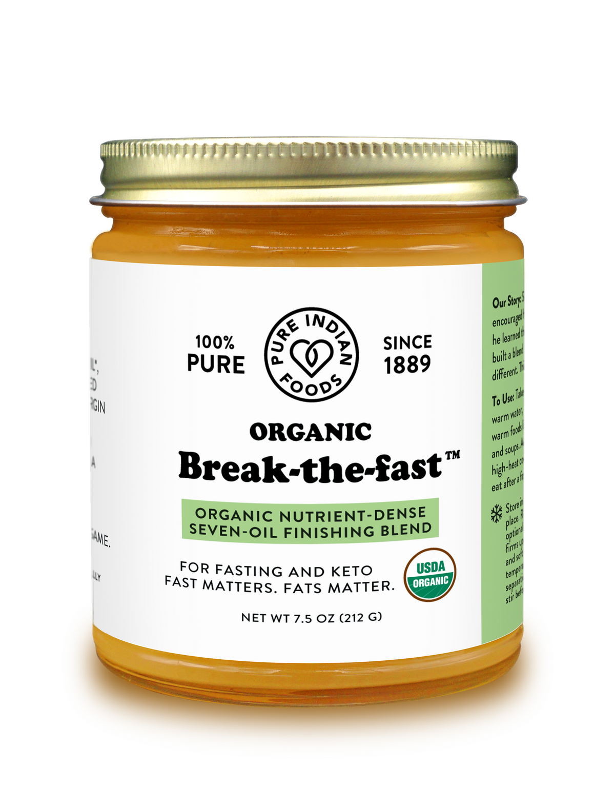A jar of Pure Indian Foods Organic Break-the-fast seven-oil finishing blend, featuring a white label with black text and a green stripe, sealed with a gold metal lid on a white background.