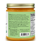 Back view of a jar of Pure Indian Foods Sandeep's Break-the-Fast Seven Oil Blend, showing the green and white label with product details, ingredients, and nutrition facts, topped with a gold metal lid.