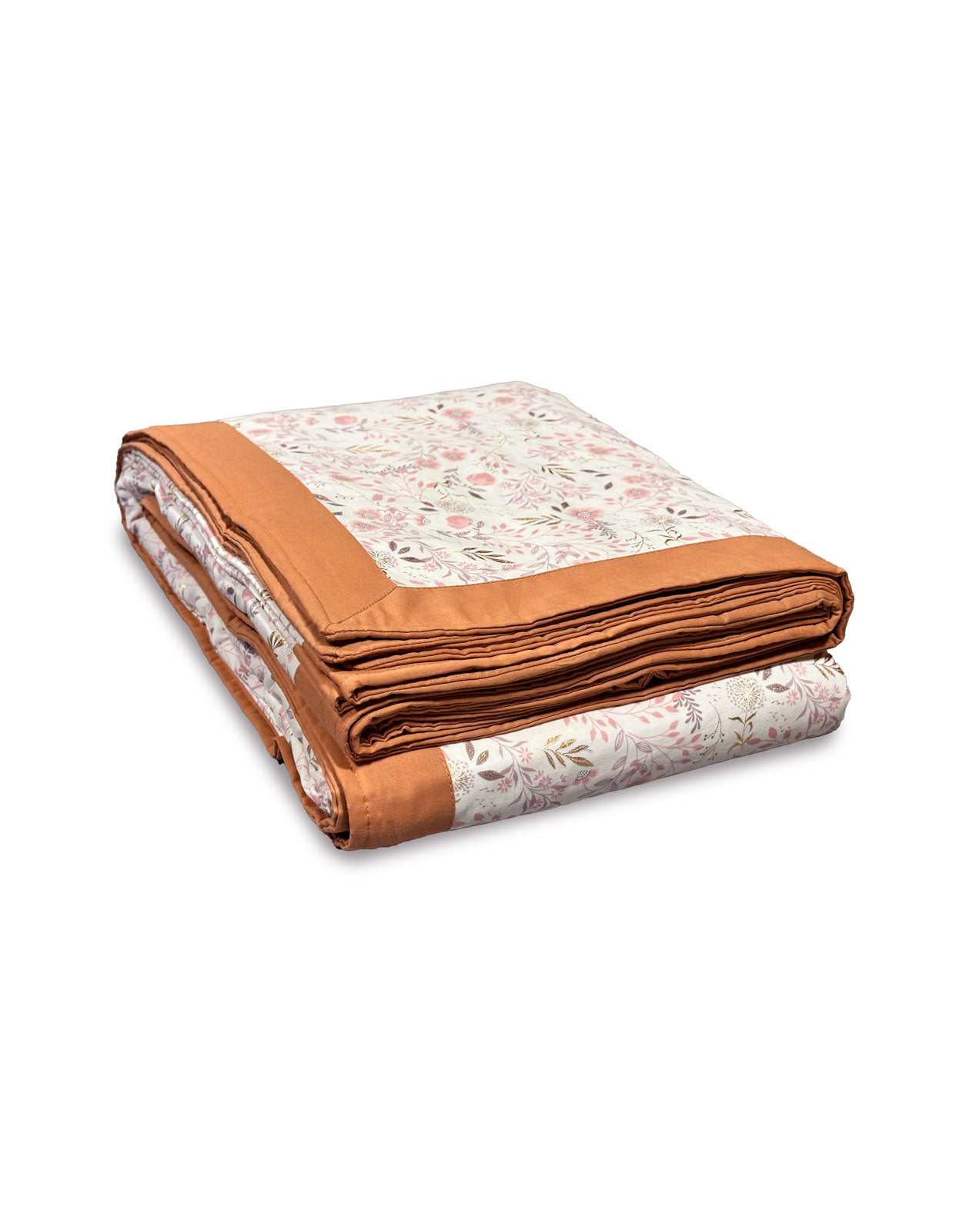 Folded handmade blanket with floral pattern and orange border made out of Upcycled cotton on a white background