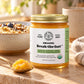 A jar of Organic Break-The-Fast nutrient dense seven oil finishing blend intended to end fasting, for keto and intermittent fasters on a kitchen counter