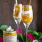 alphonso mango parfaits artistically displayed next to a jar of alphonso mango puree containing 100% pure organic mango pulp