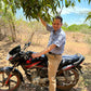 Sandeep on his motorcycle under an alphonso mango tree