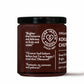 A glass jar of Pure Indian Foods Organic Kokum Chutney with a black lid and white text on a white background featuring positive quotes from taste testers.