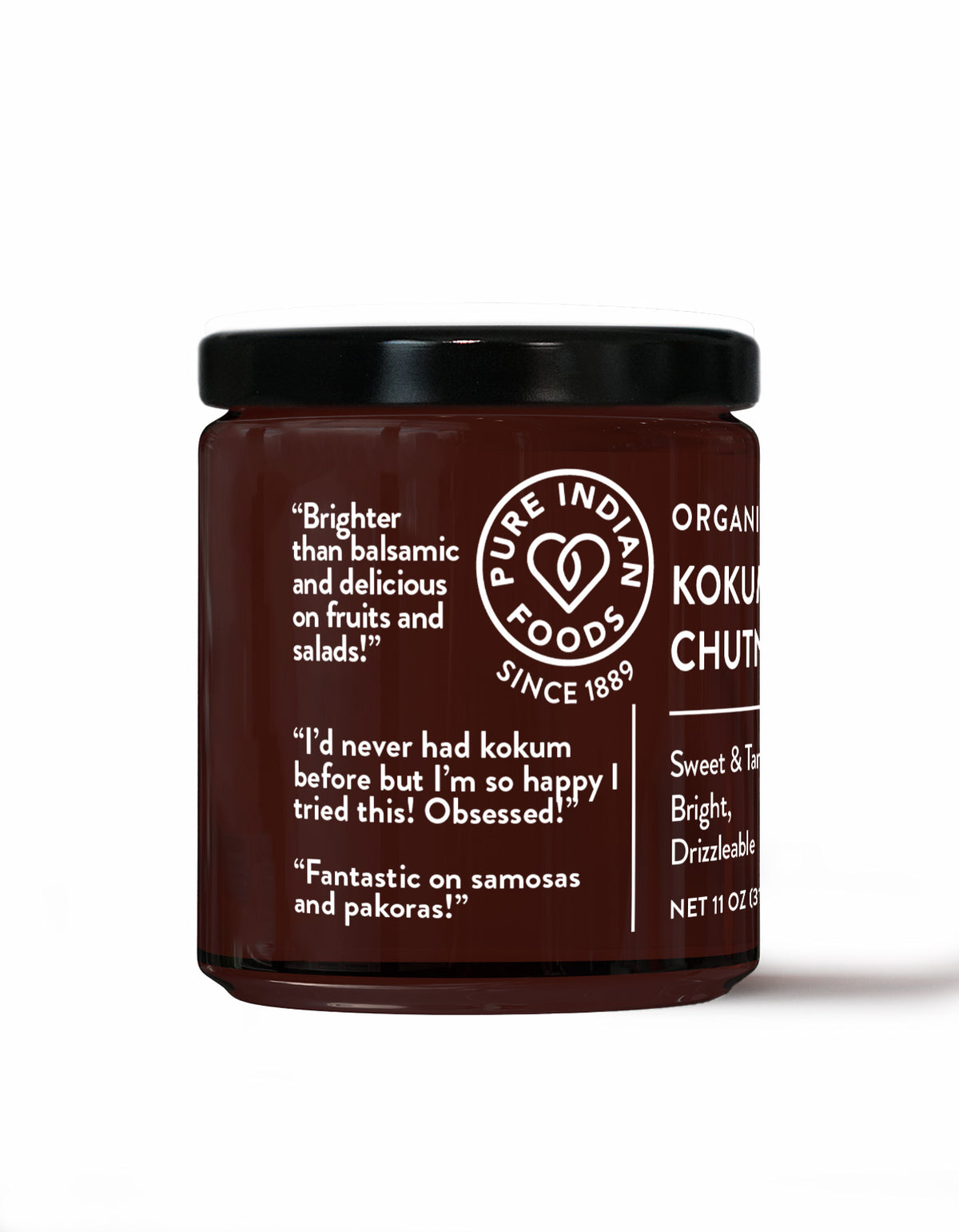 A glass jar of Pure Indian Foods Organic Kokum Chutney with a black lid and white text on a white background featuring positive quotes from taste testers.