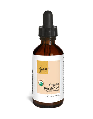 Bottle of Organic Rosehip Oil with dropper on a white background