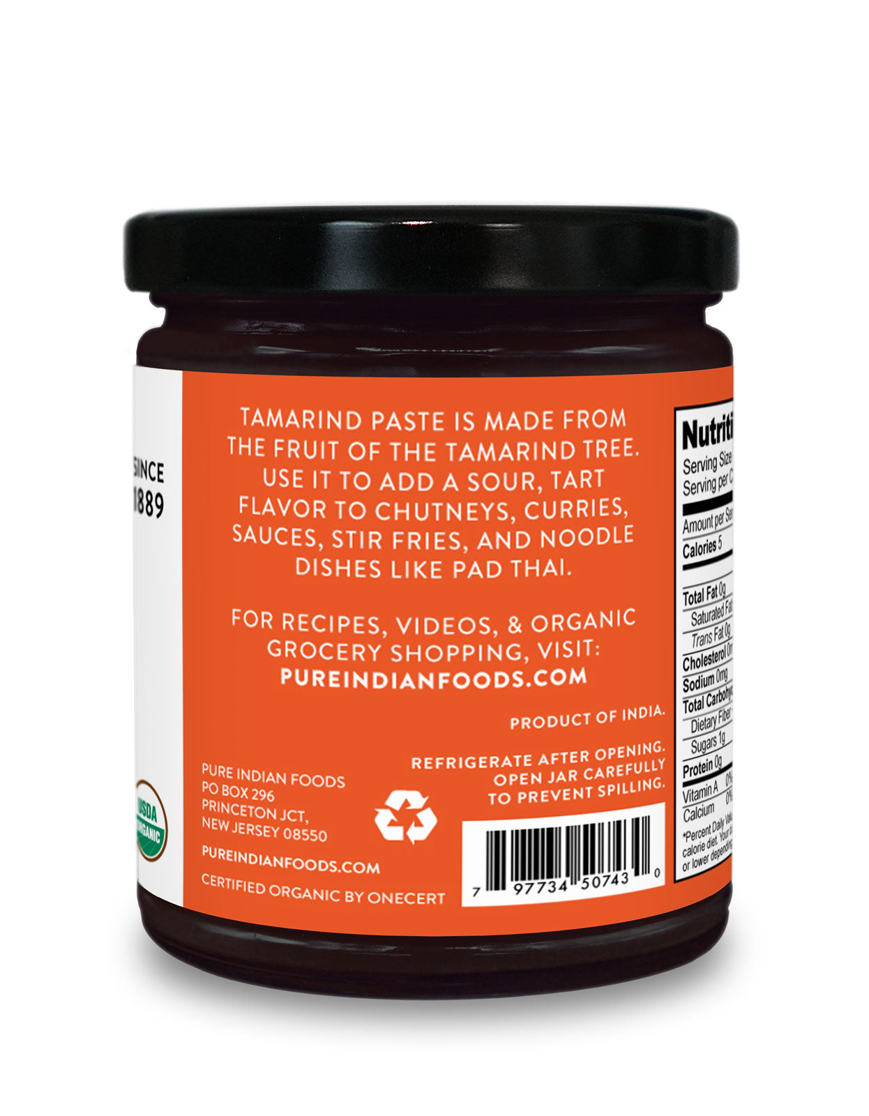 Back label of Pure Indian Foods Organic Tamarind Paste. Says "Tamarind Paste is made from the fruit of the Tamarind tree. Use it to add a sour, tart flavor to chutneys, curries, sauces, stir fries, and noodle dishes like Pad Thai." Refrigerate after opening. Visit our website for recipes and videos.