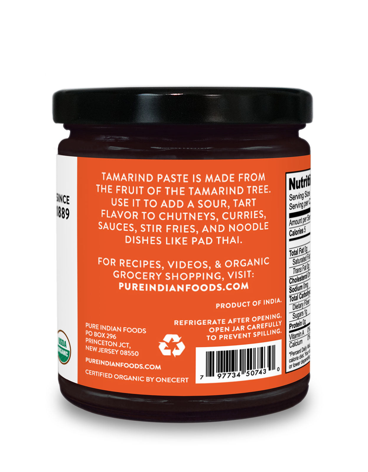 Side label on a jar of organic tamarind concentrate from Pure Indian Foods saying that tamarind paste is made from the fruit of the Tamarind tree and can be used to add a sour, tart flavor to chutneys, curries, sauces, stir fries, and noodle dishes like pad Thai.