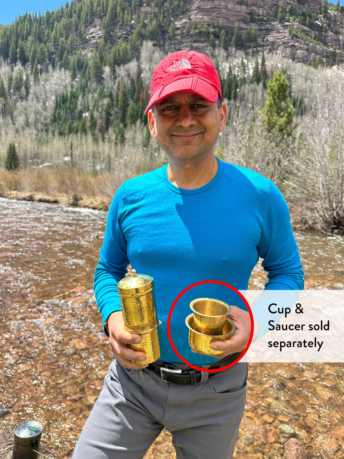 Seen here being held by Sandeep on one of his camping trips, this is our brass travel coffee maker for South Indian filter coffee from Pure Indian Foods