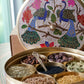 Open brass handmade masala dabba, showcasing the organic spice set inside