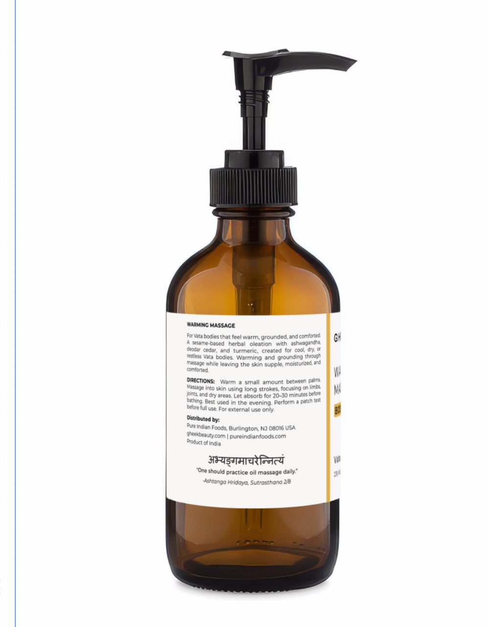 The back label on an amber bottle with a black pump of Gheek Beauty Restorative Body Oil.