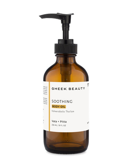 Gheek Beauty Soothing Body Oil in an amber glass pump bottle with a black dispenser and a white label, set against a plain white background.