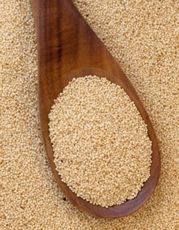 A wooden spoonful of organic amaranth grain from Pure Indian Foods