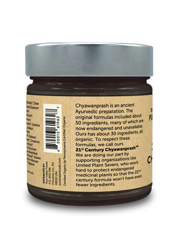 Side label of Pure Indian Foods organic chyawanprash jam. It says the orignal formulas included about 50 ingredients, many of which are now endangered and unavailable. Ours has about 30 ingredients, all organic. To respect these formulas, we call ours 21st Century Chyawanprash.