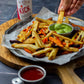 1 tray of homemade fries with dips next to a jar of KICK Salt, a blend of organic ghost pepper and Himalayan pink salt from Pure Indian Foods