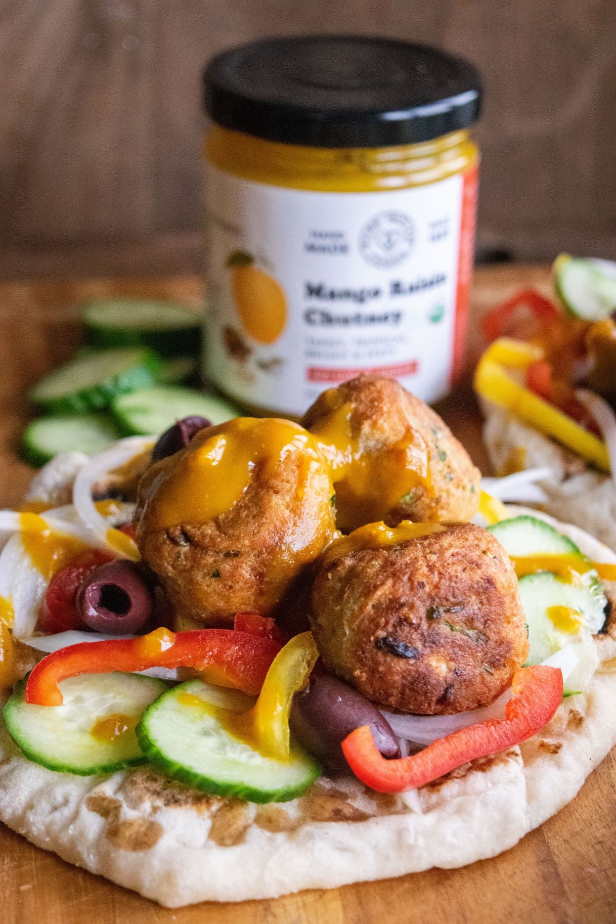 Gorgeous falafel and veg on pita with our tasty organic mango chutney in the background.