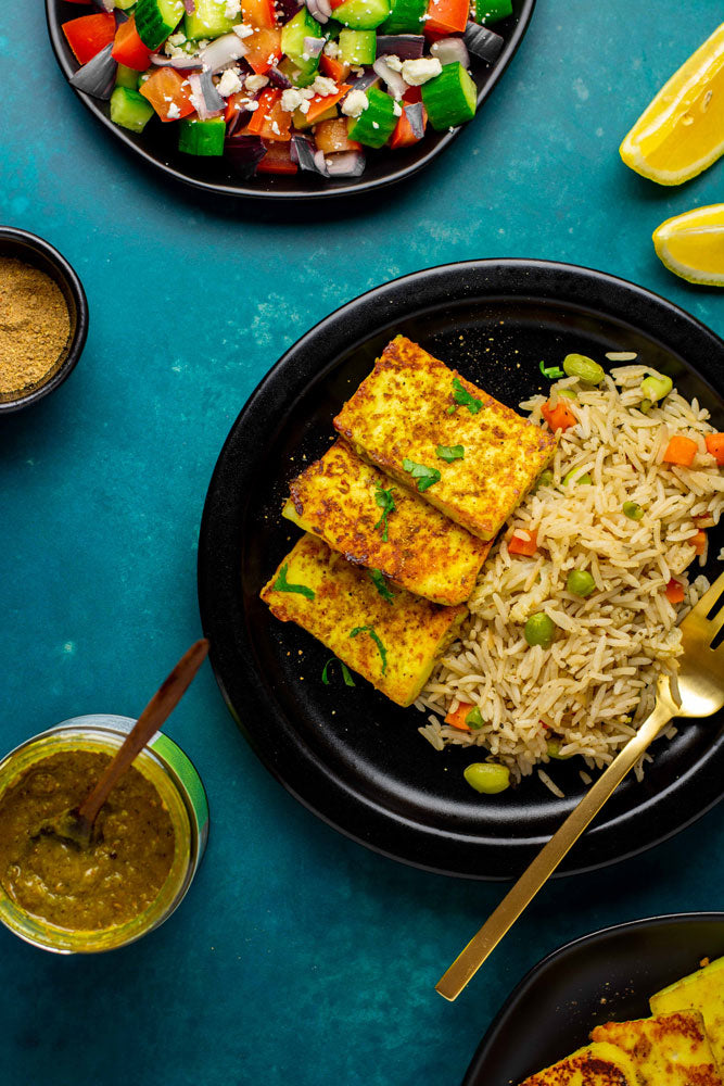 South Indian vegetarian meal of paneer marinated in our organic madras curry simmer sauce served with rice and Chaat.