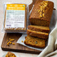 Photo of Pure Indian Foods Organic Jaggery, also known as panela or rapadura, next to a loaf of bread that was baked with it.