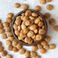 Birds eye view of a bowl filled with organic sacha inchi nuts from Pure Indian Foods, the Incan seeds that taste nutty, but aren't actually nuts.