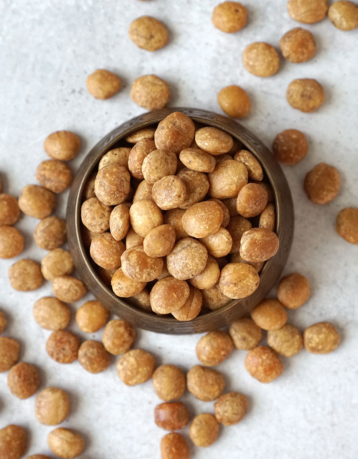 Birds eye view of a bowl filled with organic sacha inchi nuts from Pure Indian Foods, the Incan seeds that taste nutty, but aren't actually nuts.