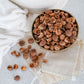 Bowl of organic soap berries from Pure Indian Foods pictured with small muslin bags for laundry.