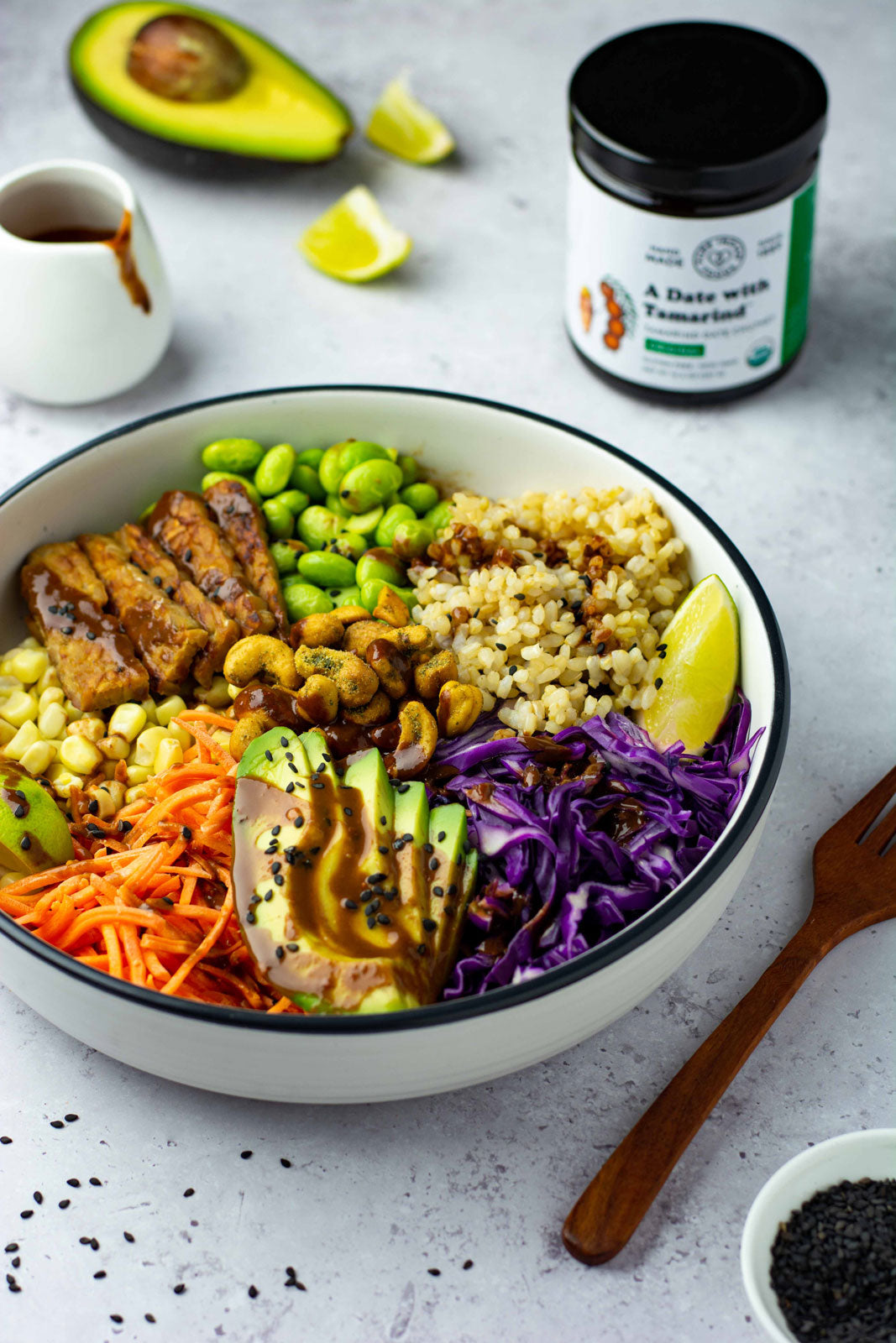 A vegetarian tempeh rice bowl drizzled with the tamarind chutney from Pure Indian Foods.