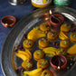 tray of almond mango pedas, a type of indian mango fudge, made with alphonso mango puree containing 100% pure organic mango pulp and organic grassfed ghee